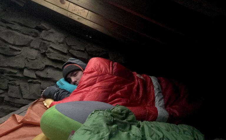 Sierra-Designs-Backcountry-Quilt-sleeping-in-shelter-2-featured
