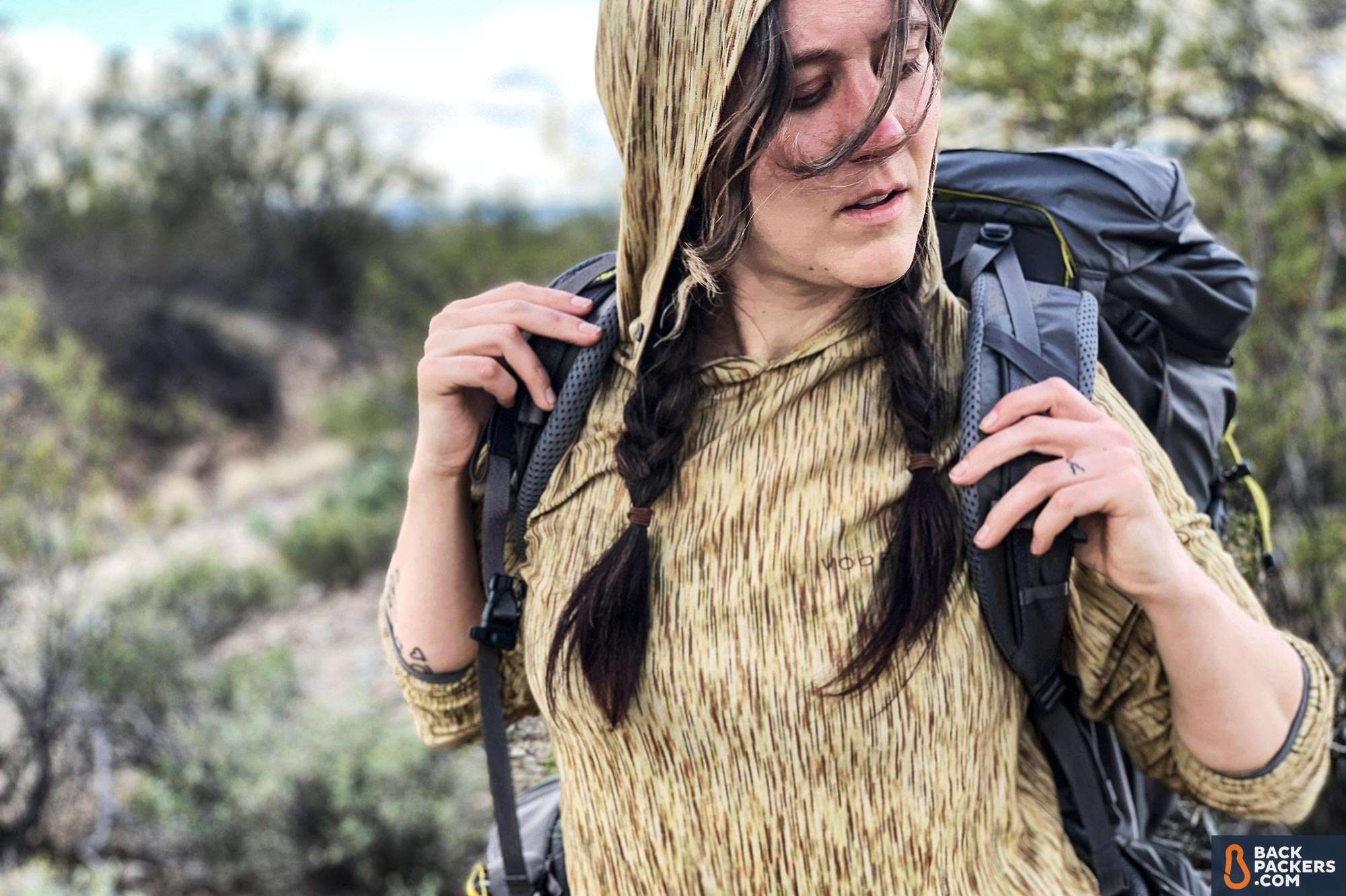 REI Flash 55 Review: Ultralight Meets Affordable 2 REI-Flash-55-carrying-the-backpack-s-curve-shoulder-straps